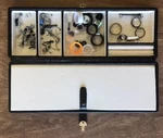 Guages, Plugs, Earrings, Etc. Various Lot Including Case. Fixed Price $22.15.